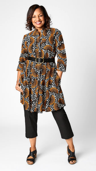 Model wearing “Slice of Life” print Zuri dress with black tapered cropped pant in poplin, black leather belt, and black leather wedge sandals.