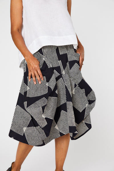 Close-up of black and white geometric print skirt.