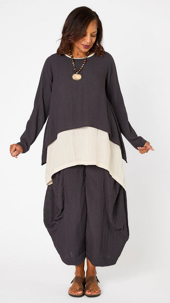 Model wearing black pearl long sleeve cropped top with A-line silhouette, cloud layer tank, and black pearl double pocket pant.