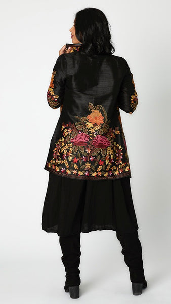 Rearview of floral embroidered black silk jacket.