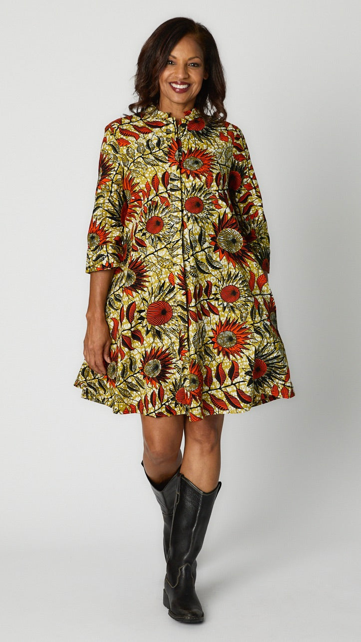 Model wearing Sunflowers Zuri dress with black leather boots