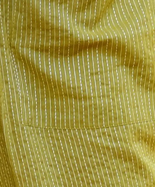 Close-up of "Mustard tagai" fabric.