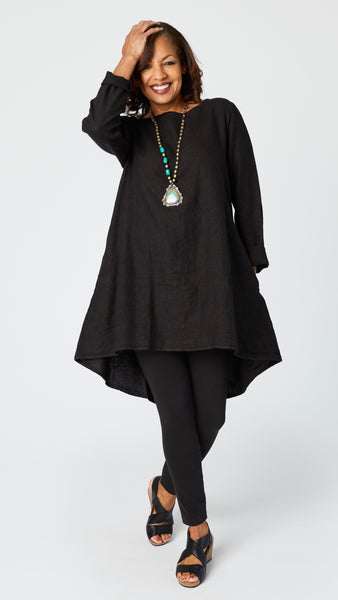 Model wearing black linen tunic over black cotton full length legging with turquoise necklace and black leather sandals.