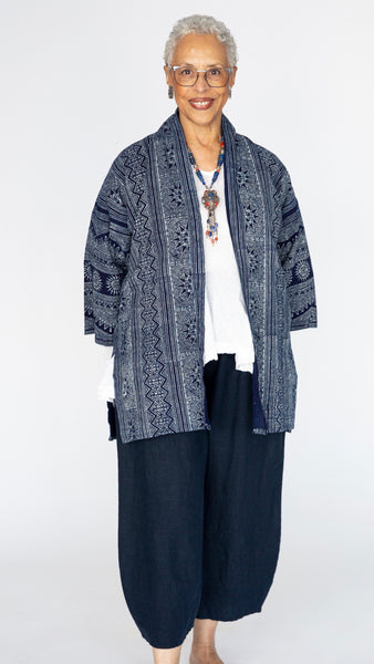 Model wearing indigo block print cotton kimono, white t-shirt, cropped wide leg linen lantern pant.