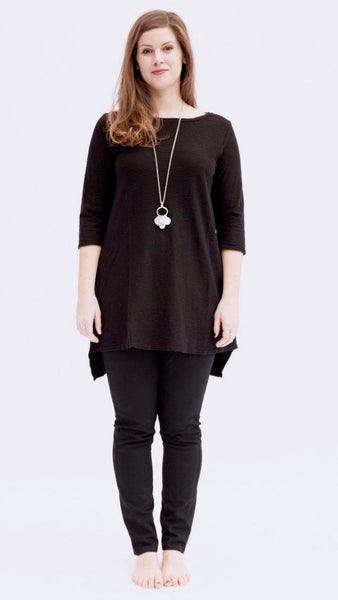 Model wearing black cotton/linen jersey high-low tunic over black full length cotton legging.