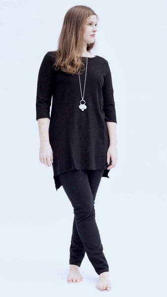 Model wearing black cotton/linen jersey high-low tunic over black full length cotton legging.