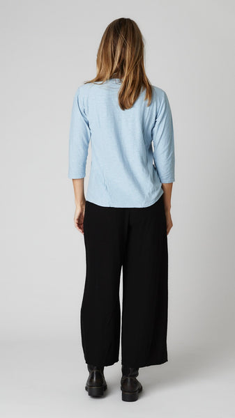 Model wearing cove cotton-linen knit 3/4 sleeve bias cut tee, black cotton-linen knit cropped dart pant, and black leather boots.