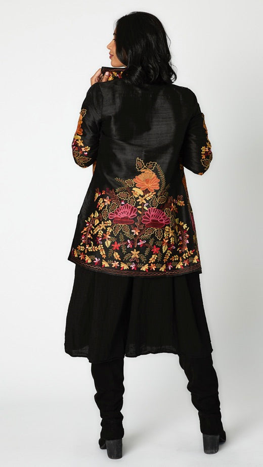 Rearview of floral embroidered black silk jacket. 
