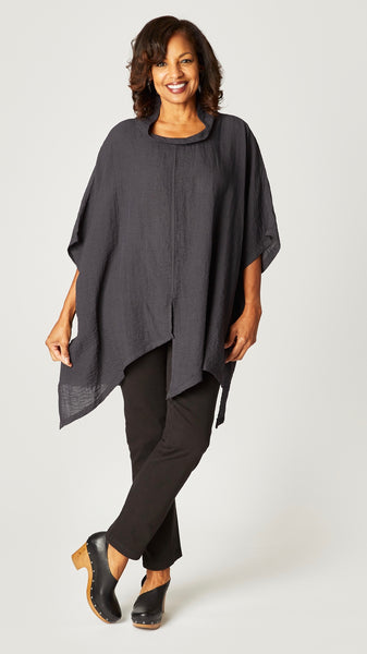 Model wearing black pearl loose cowl neck tunic with asymmetrical hem and 3/4 sleeves, and black straight leg jeans.