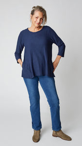 3/4 Sleeved Top in cotton/linen jersey. Navy blue with pockets in the side seam and freyed rounded neckline. Flares slightly at the hips.